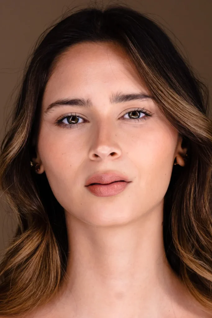 Stock portrait with softly styled brunette hair